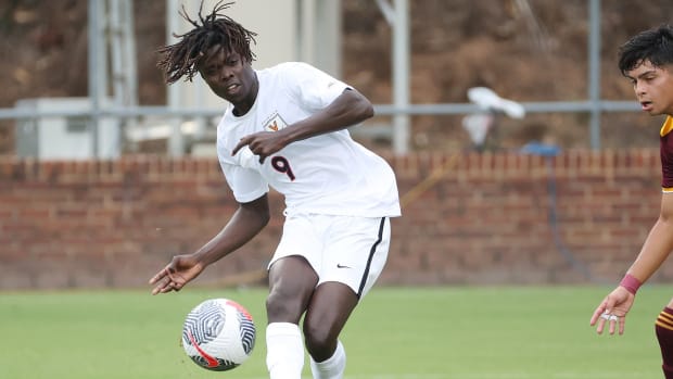 Stephen Annor Gyamfi takes a shot during the Virginia men's soccer game against Iona at Klockner Stadium.